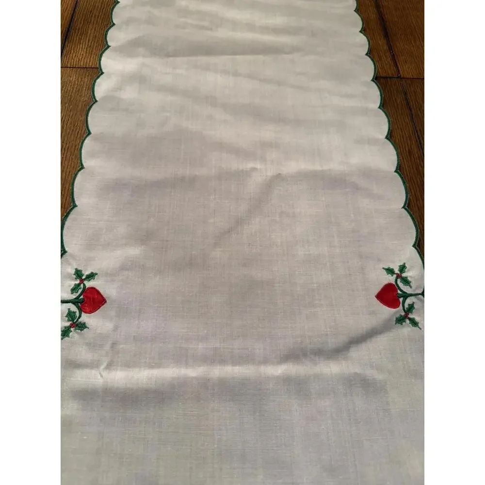 Table runner appliqued with red hearts and embroidered holly leaves 88” X 13.5”